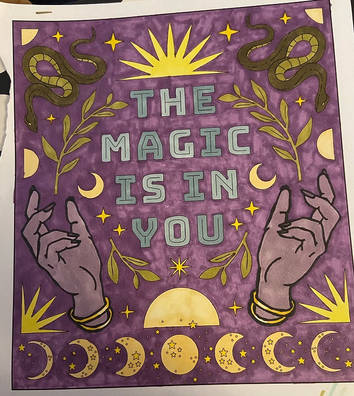 A colored image including suns, moons, snakes, and hands framing the phrase 'The Magic Is In You.'