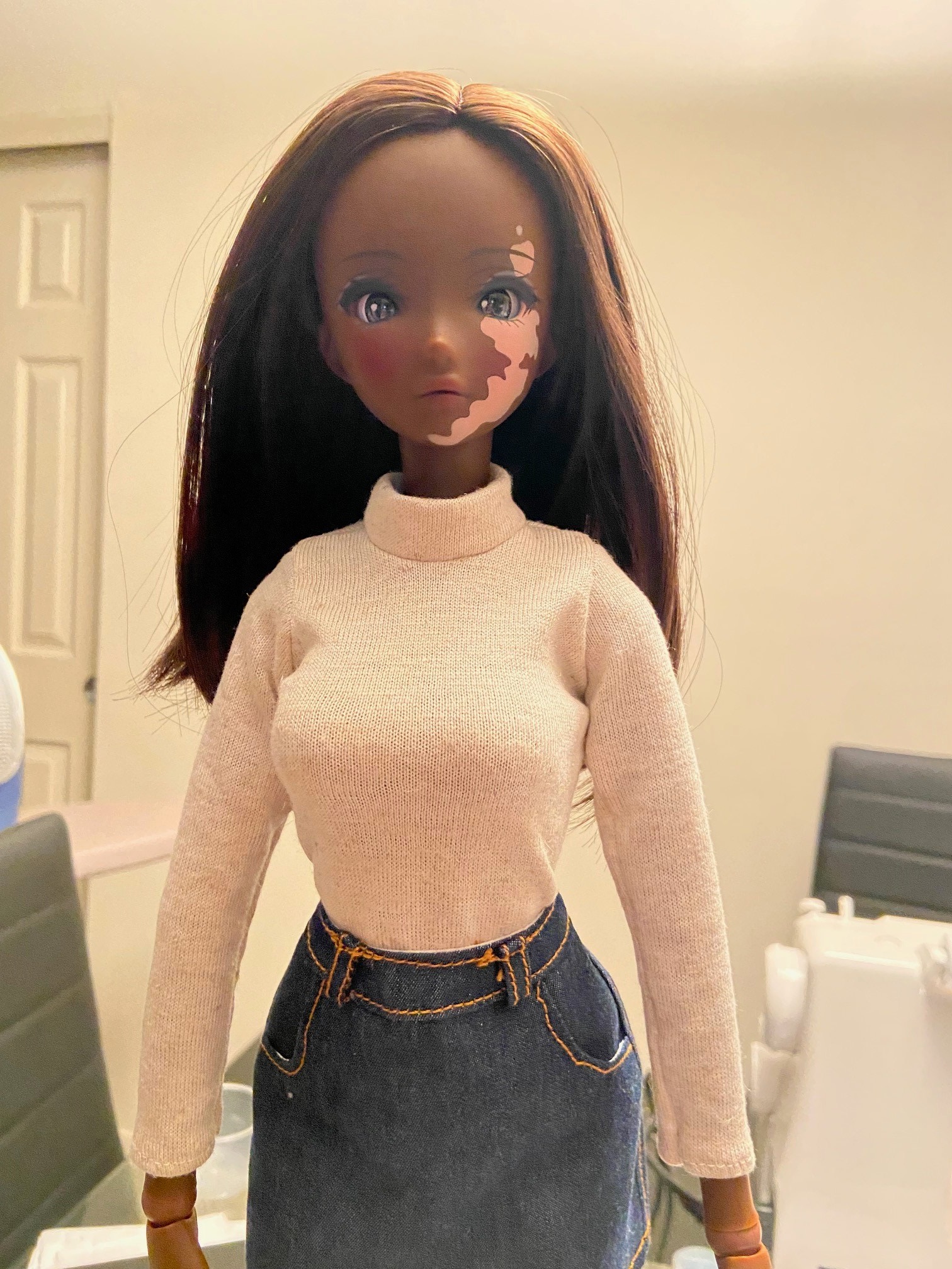 A Smart Doll Liberty in a white sweater.